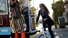 woman riding bicycle with jacket - tern bicycle